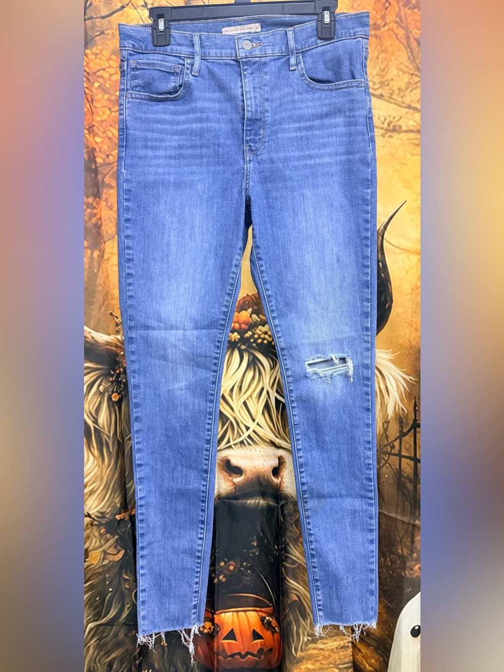 Levi's 720 Blue High Rise Super Skinny Jeans with Distressed Knee and Frayed Hem